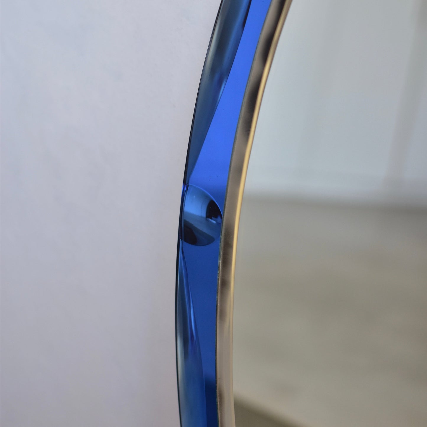 Vintage mirror with cobalt blue glass frame