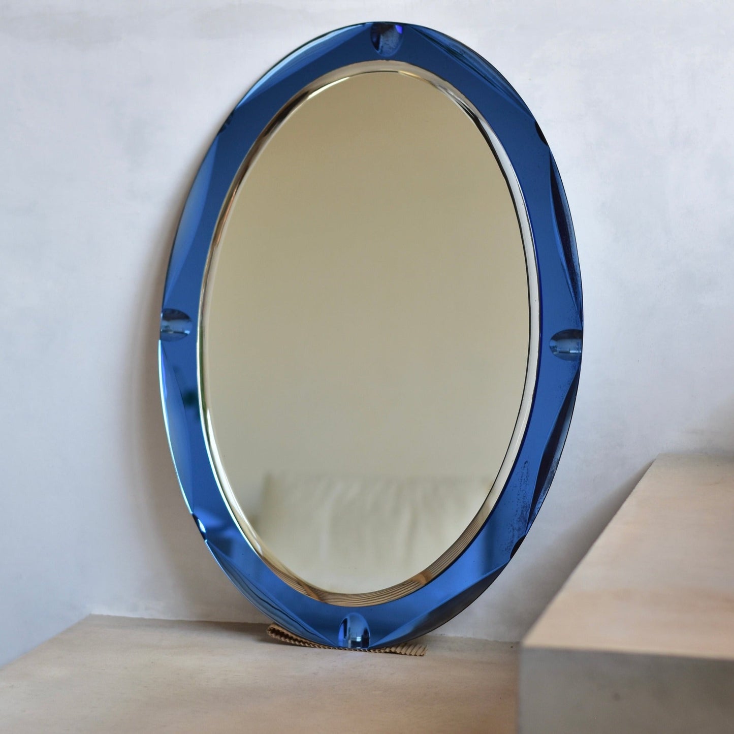 Vintage mirror with cobalt blue glass frame